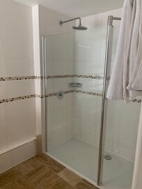 Fantastically  clean bathroom with top end details on prep for guest and an enormous shower!