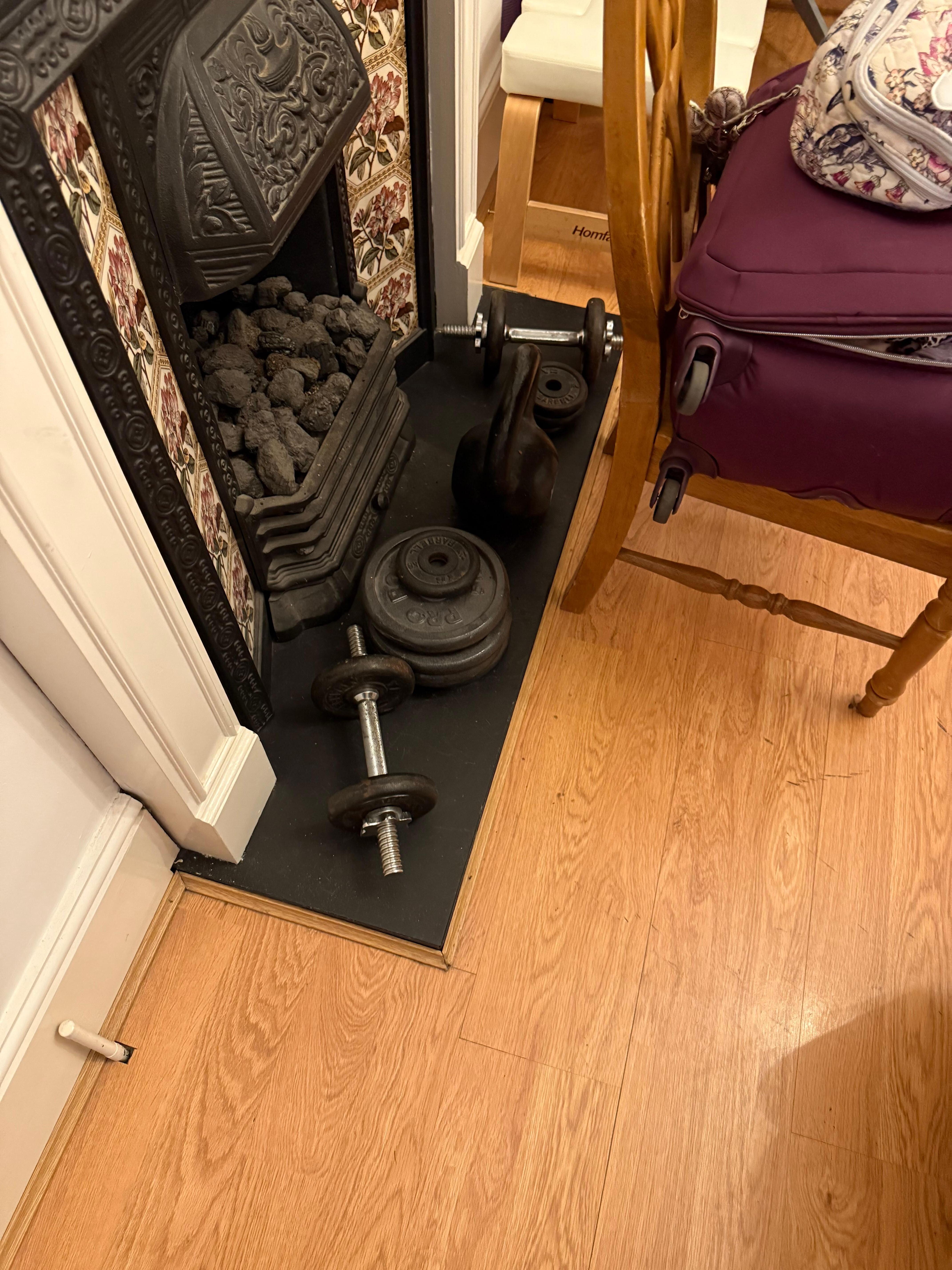Owners weights and workout equipment in room.