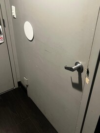 Walls and doors are dirty and scratched