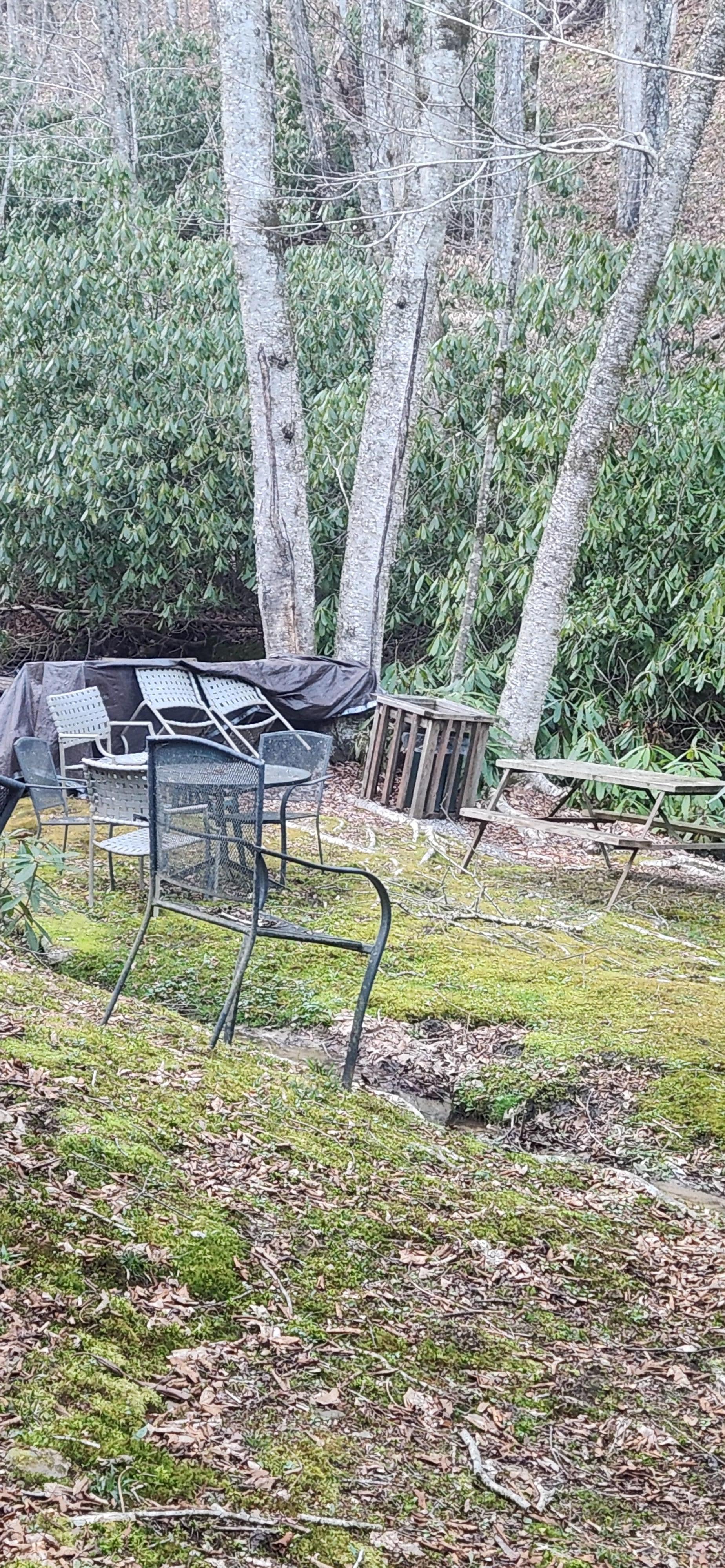 Eye sore rotten wood tables by river