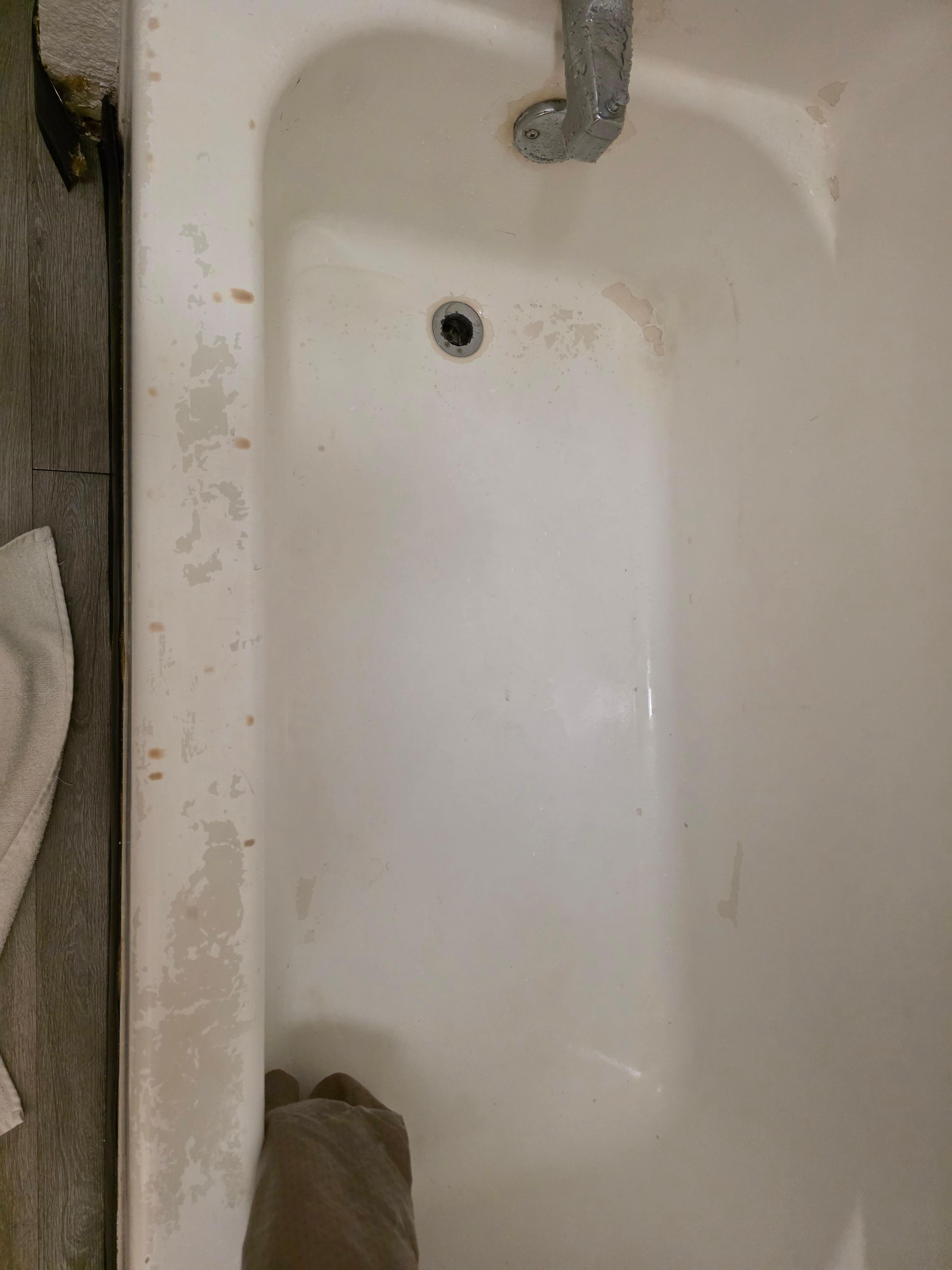 Tub mold, rust, dragging shower curtain, no drain plug