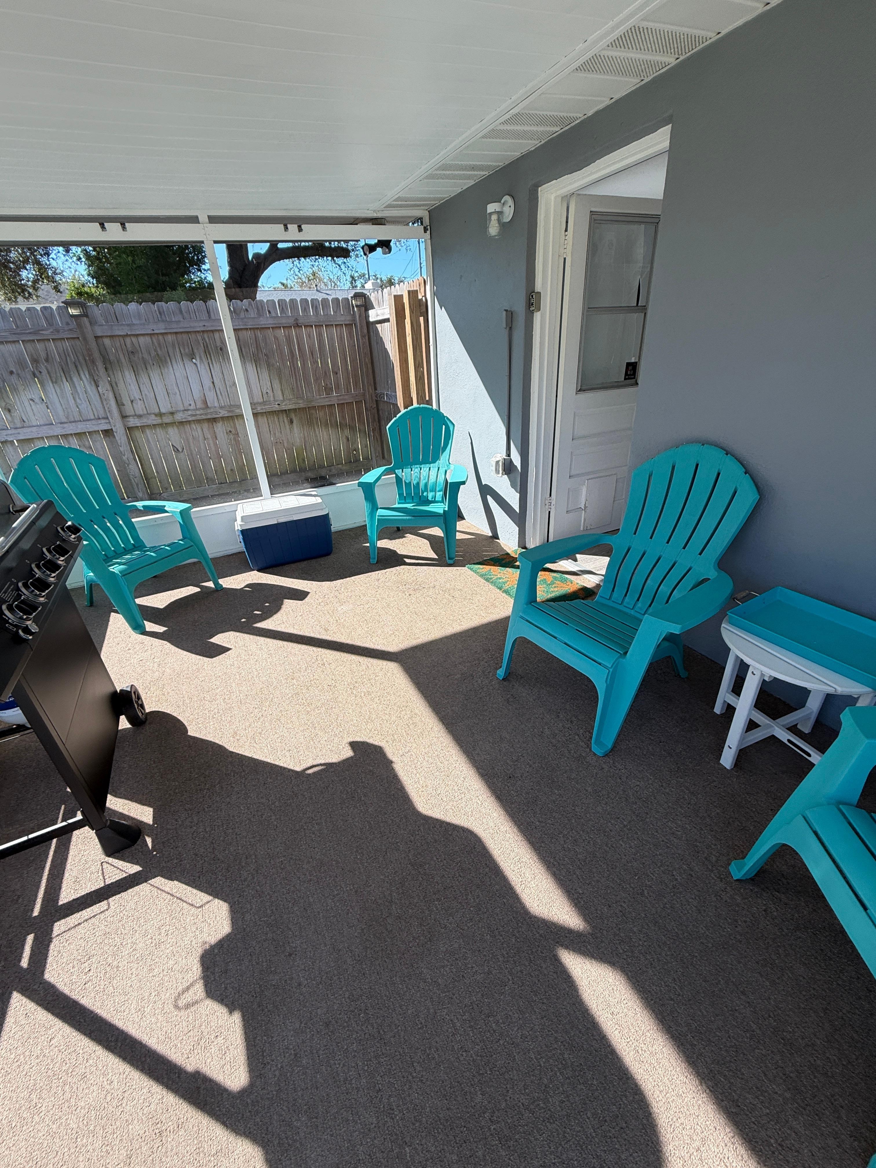 Screened in porch leads to large yard