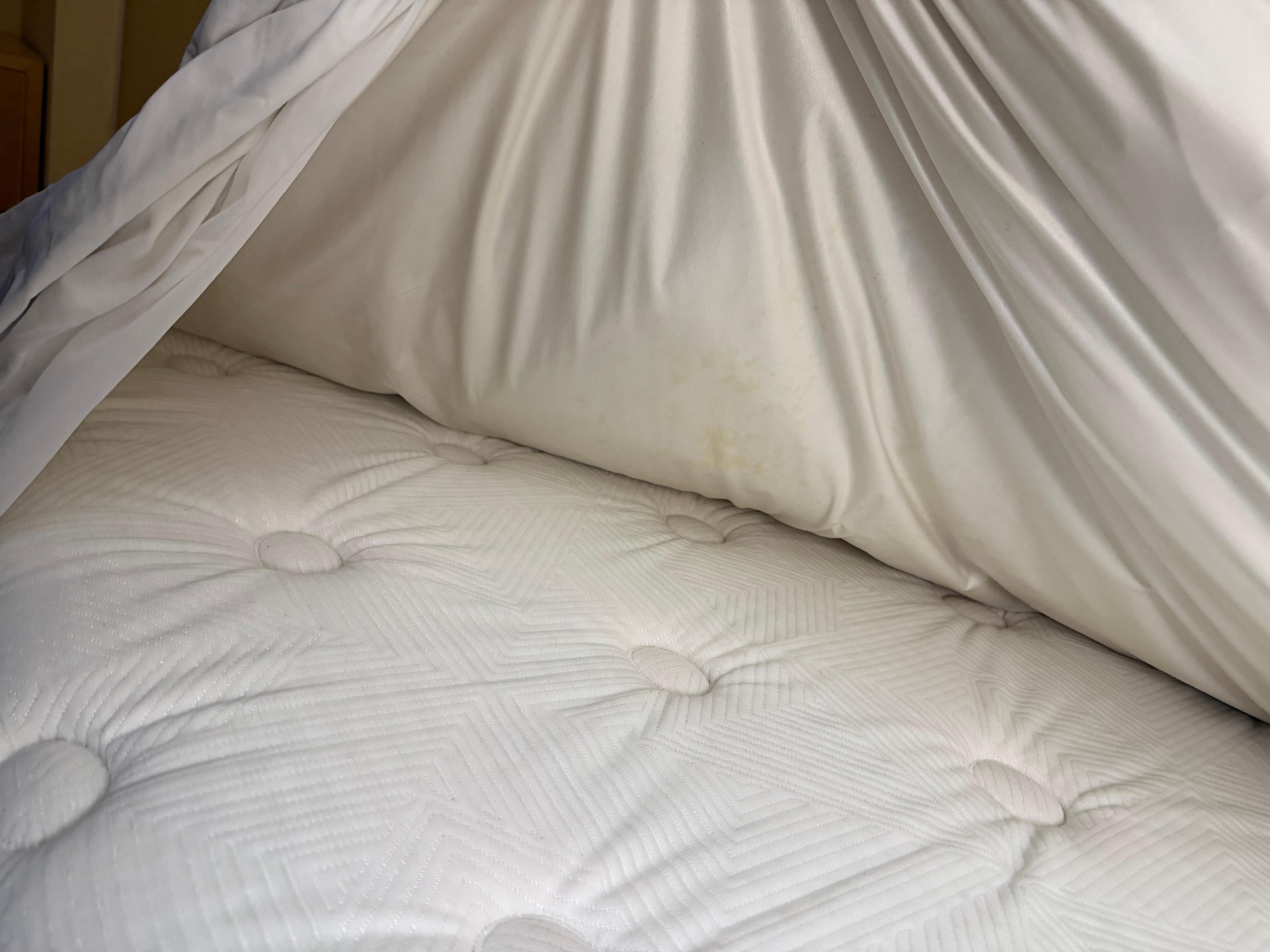 Yellowing/stains on bed and bedding material