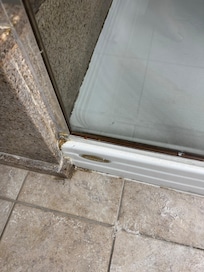 Whatever this is around the shower and tub.