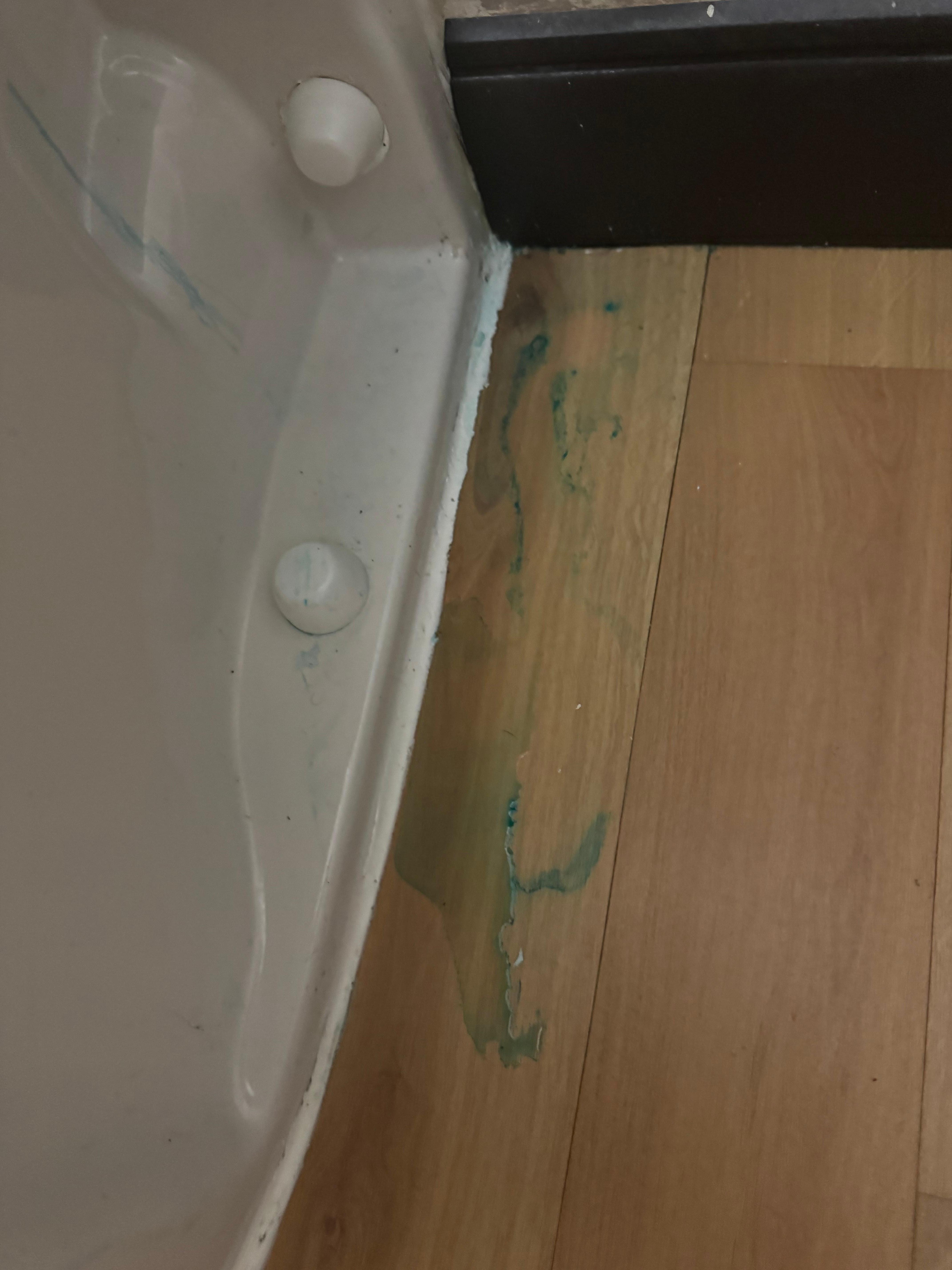 Blue substance found on the bathroom floor in multiple places. 