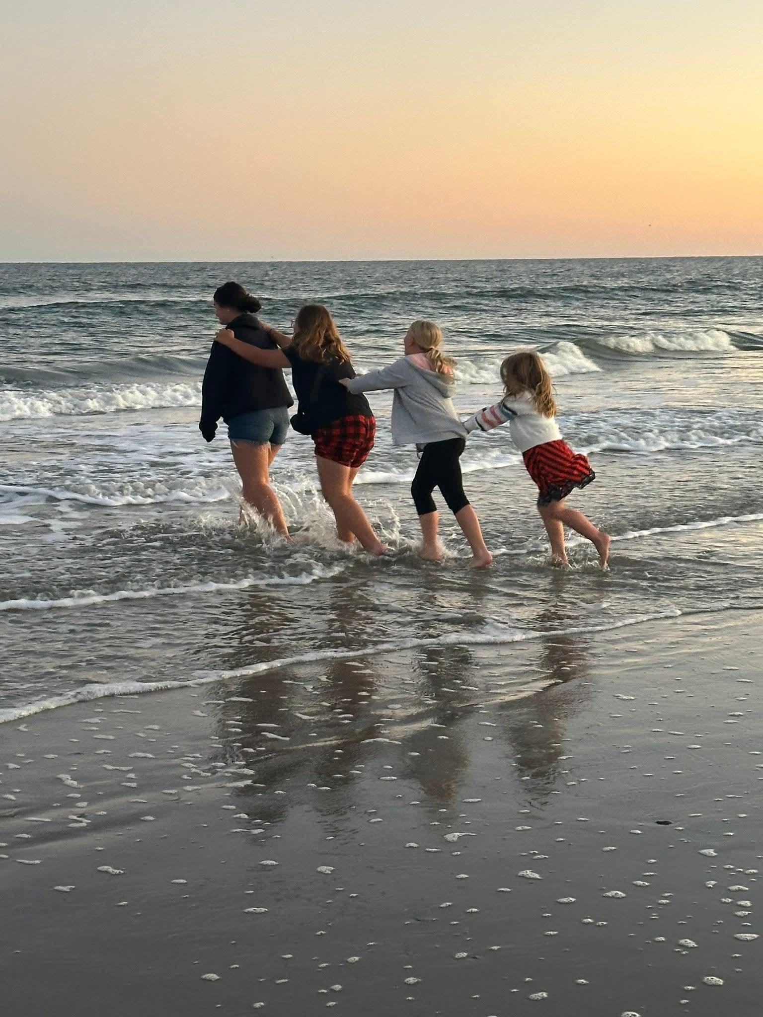 Four granddaughters - shenanigans at the beach.