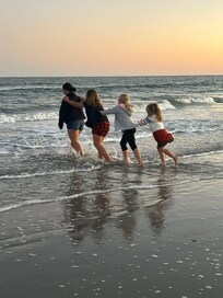 Four granddaughters - shenanigans at the beach.