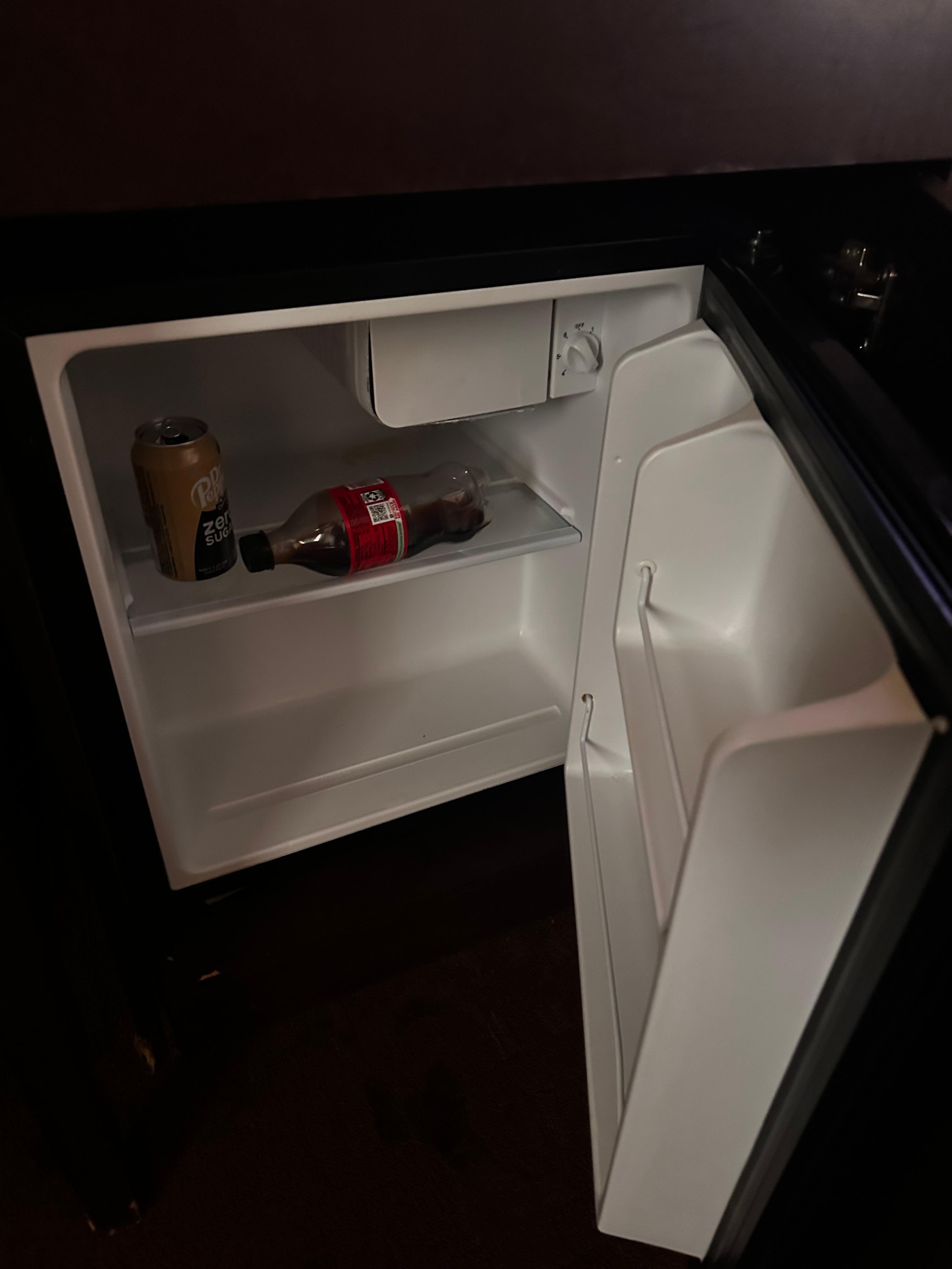 Fridge with leftover drinks. 