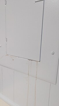 Rust water coming from electrical panel.