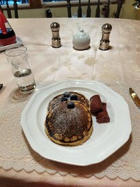 Photo of flapjack breakfast with reindeer sausage