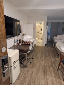 This is us walking into our room. Unacceptable we expect to receive the services we are paying for whick is a clean and ready room at check in not an hour after check in.