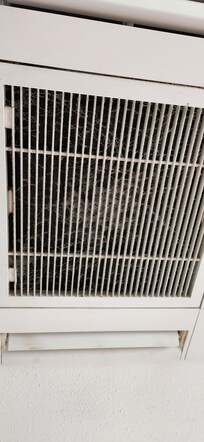 Air vent with layer of dust