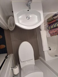 View of little room between sink and toilet.