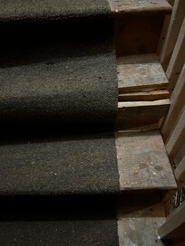 Broken step that leads into home from garage