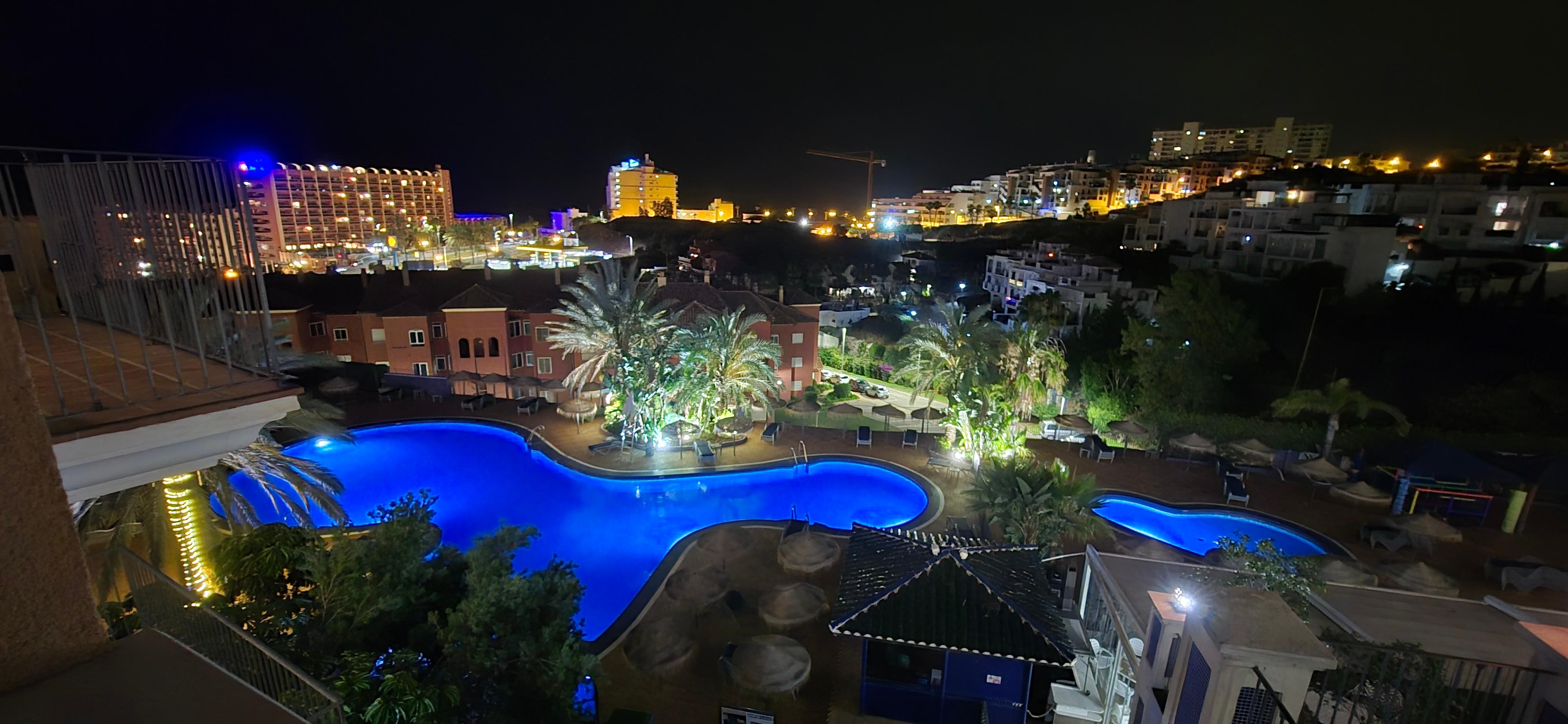 Night view from the balcony overlooking the pool