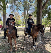 Friendly policemen on horseback patrol Sabana Park!