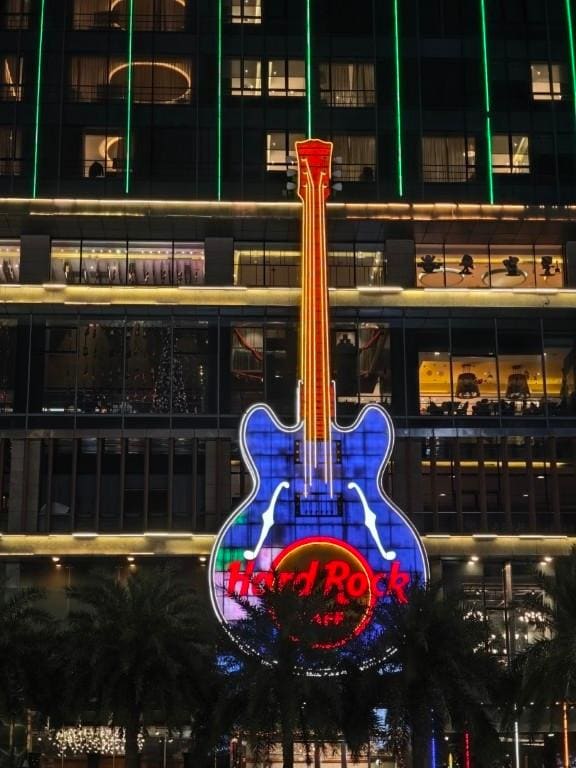 It's hard to miss the iconic guitar on the outside of the hotel at night.
