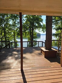 The deck overlooking the water is spacious. Coffee mornings, dinner evenings, a balance if sun + shade and even during rainy times we sat here. SO many different chairs to choose from + a swing!