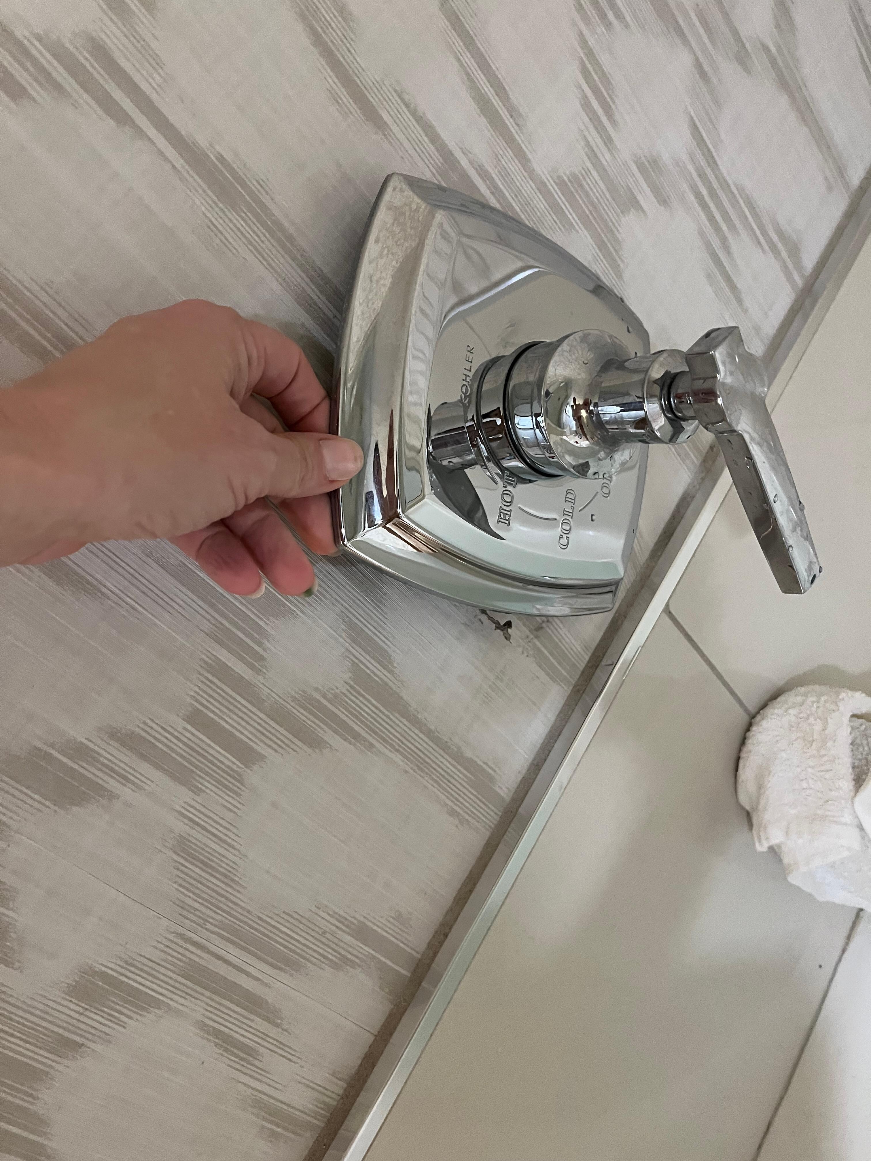 Loose and flopping trim plate on the bathtub