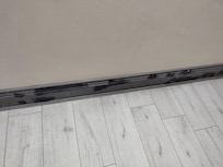 Black patches over skirting board