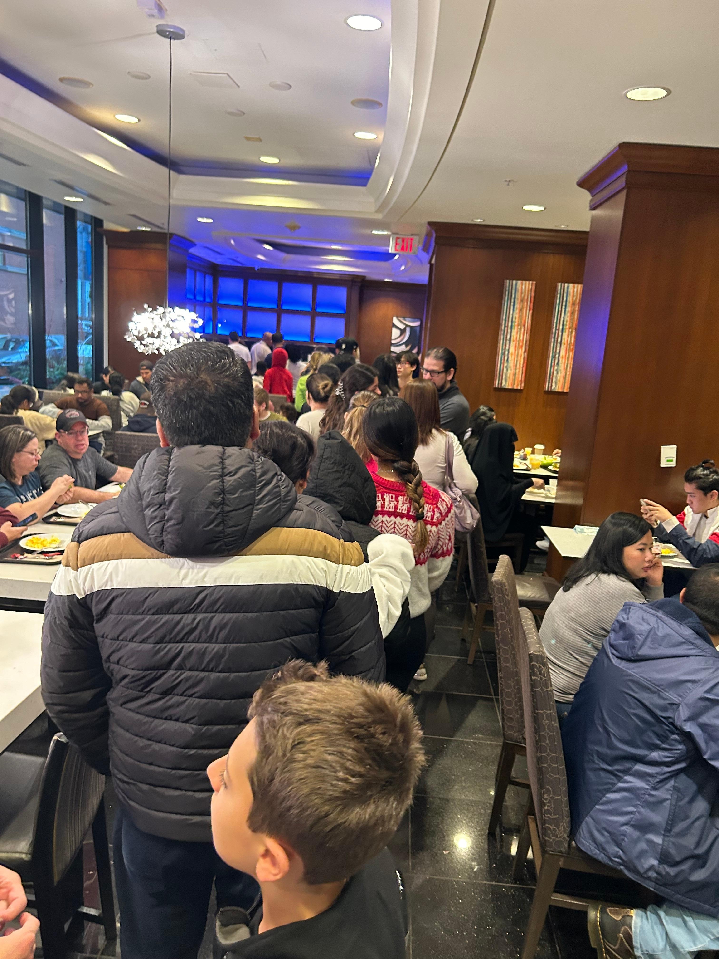 40ā in line waiting breakfast