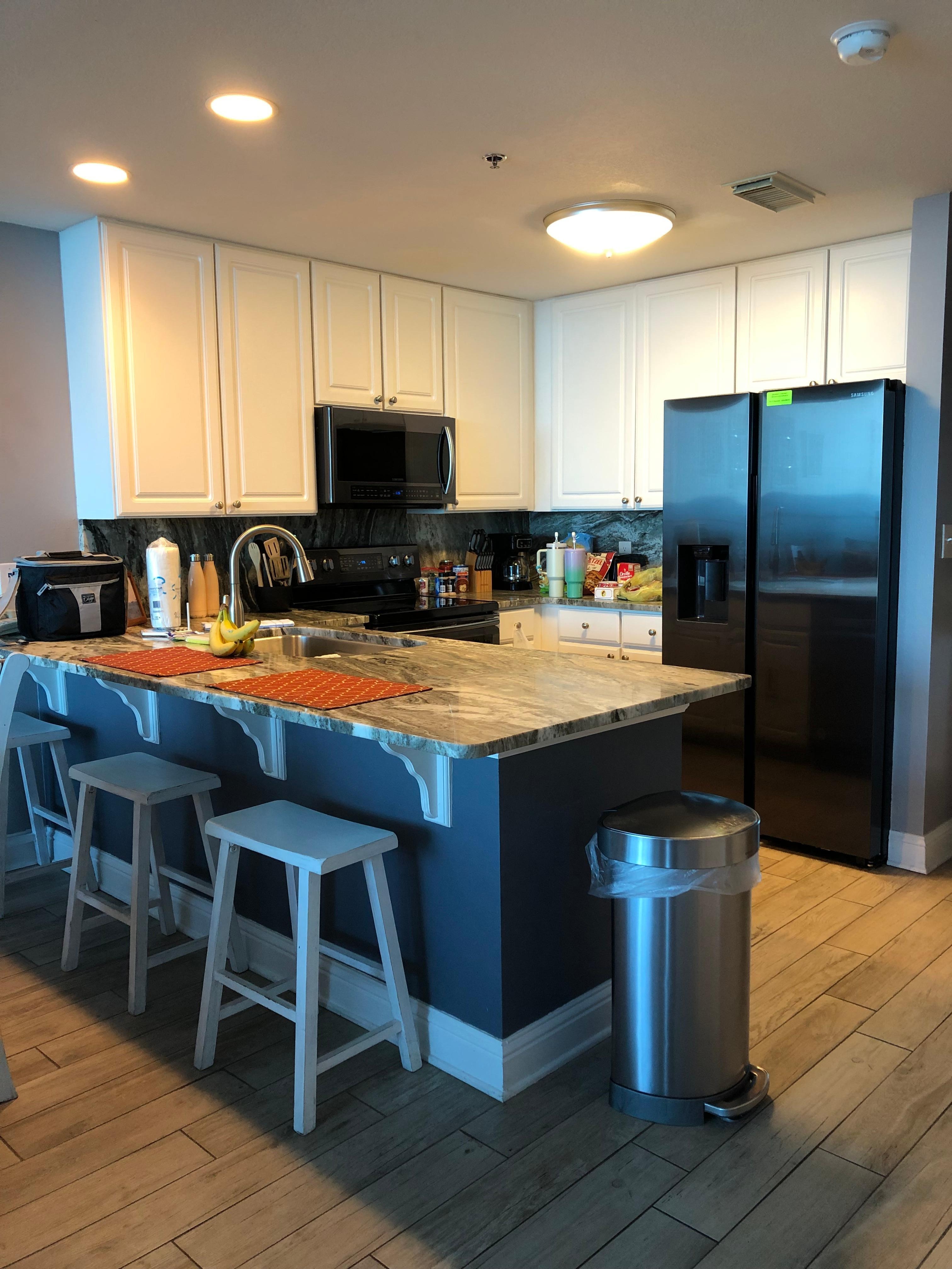 Kitchen with plenty of cookware, etc.