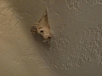 the gouge in the wall note no residue from the gouge indicating that this happened previously