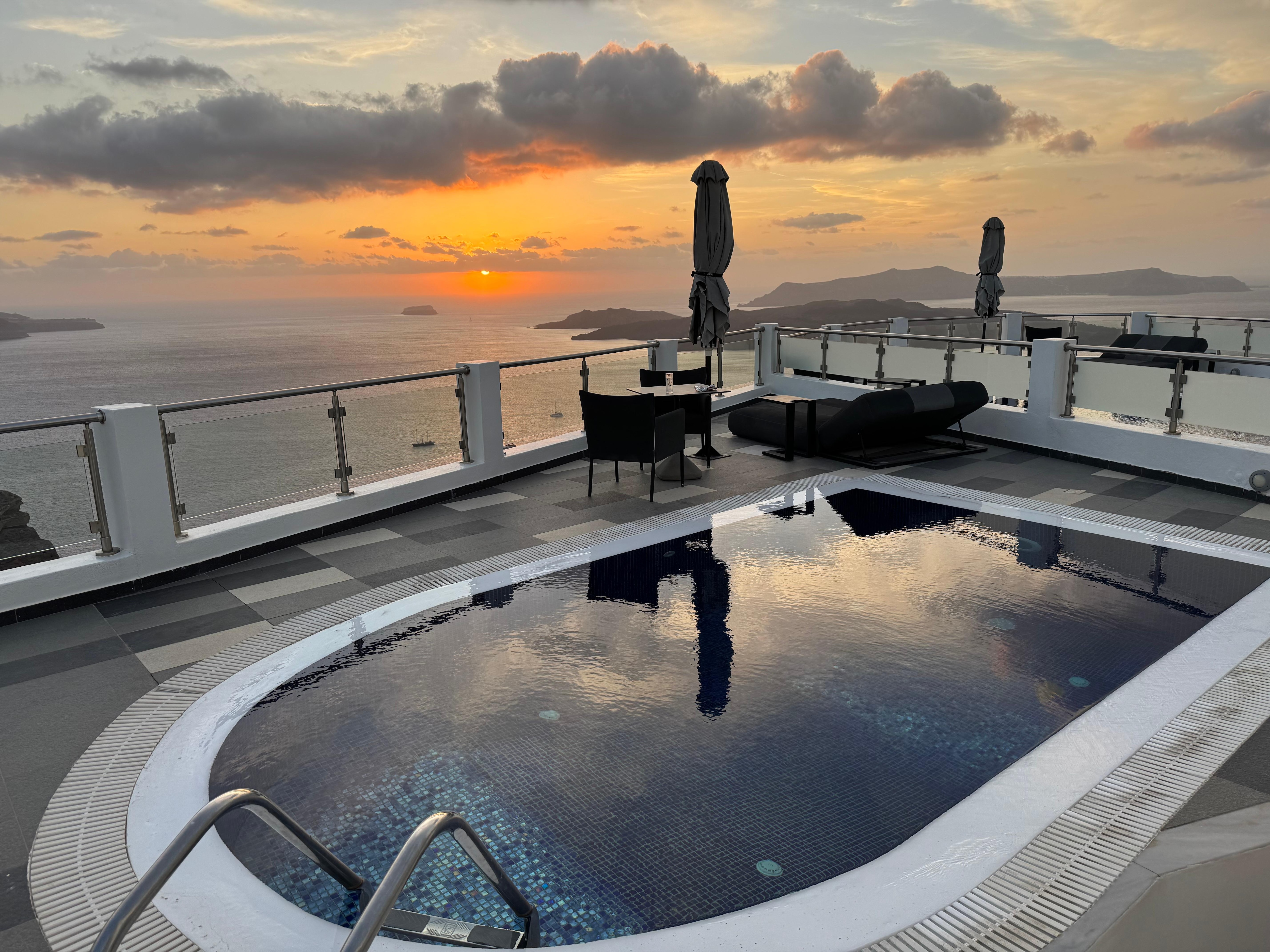 View from our upper patio down to the private balcony with heated pool. 