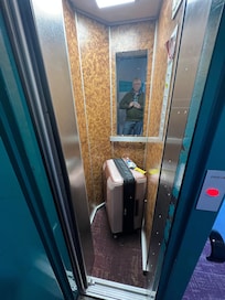 Elevator big enough for one person and one bag