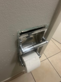 Hanging out of the wall.