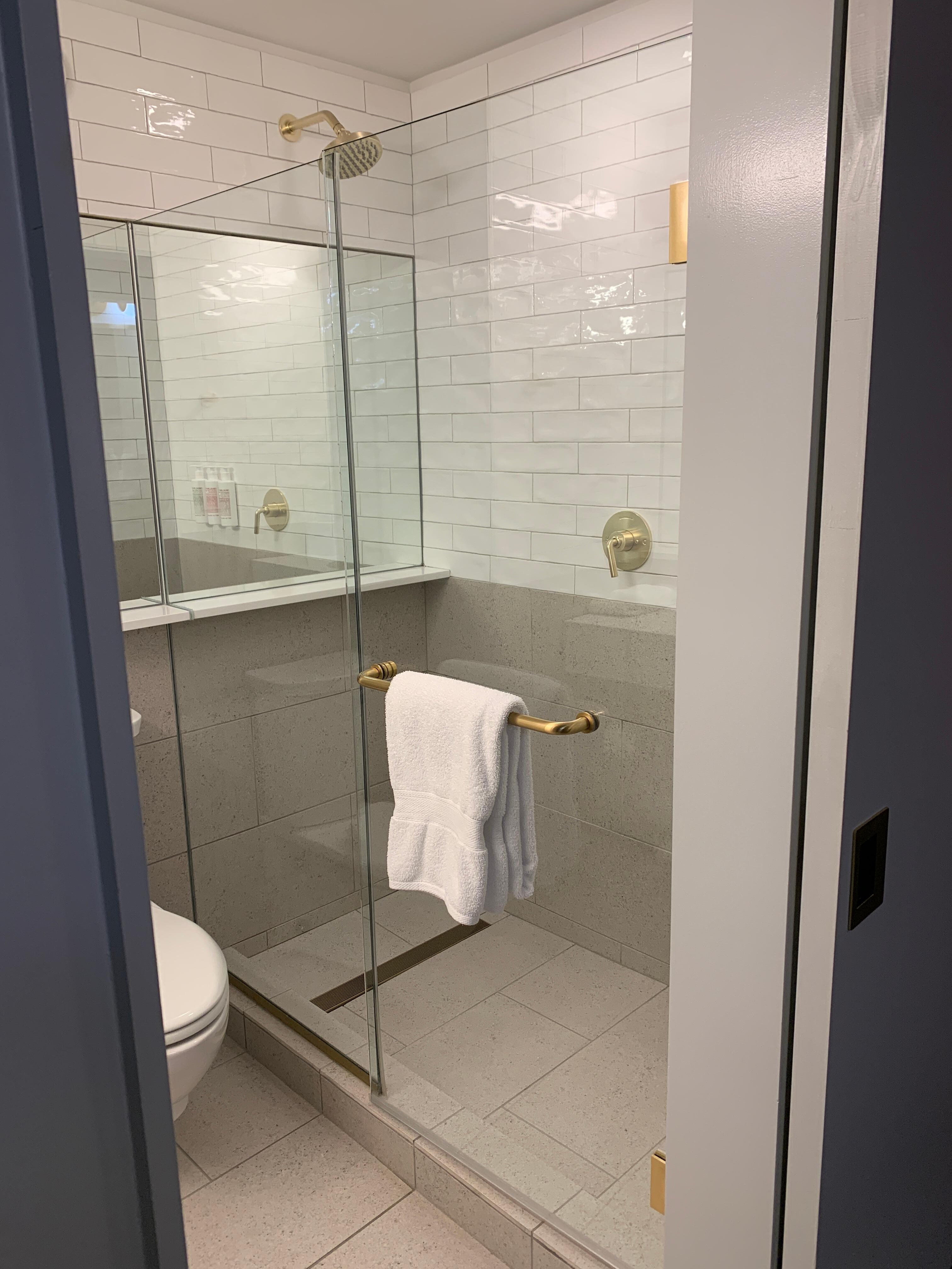View of large walk in shower