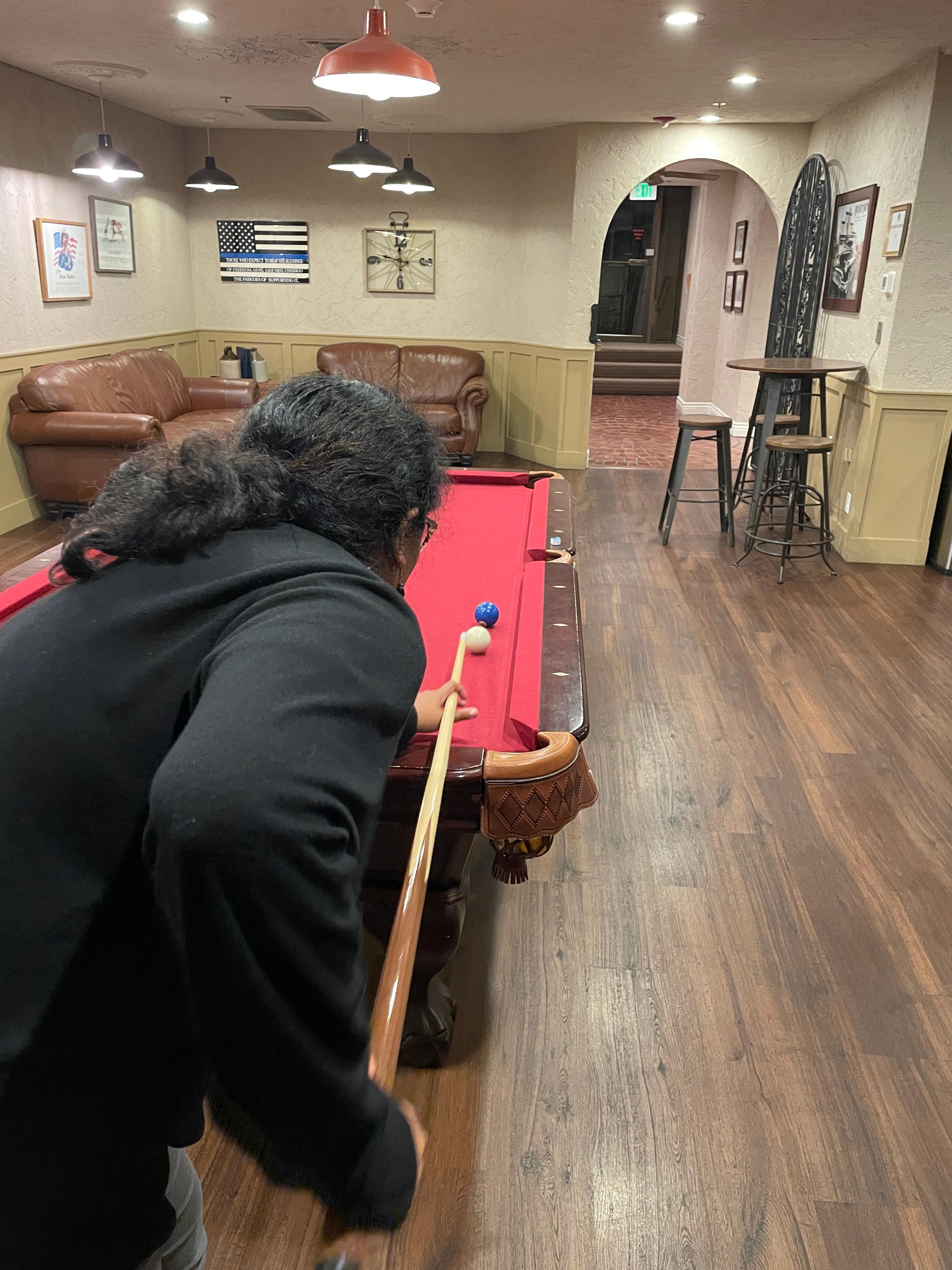 Nice pool table on lounge floor, next to indoor swimming pool, coffee tea area, and exercise room. 