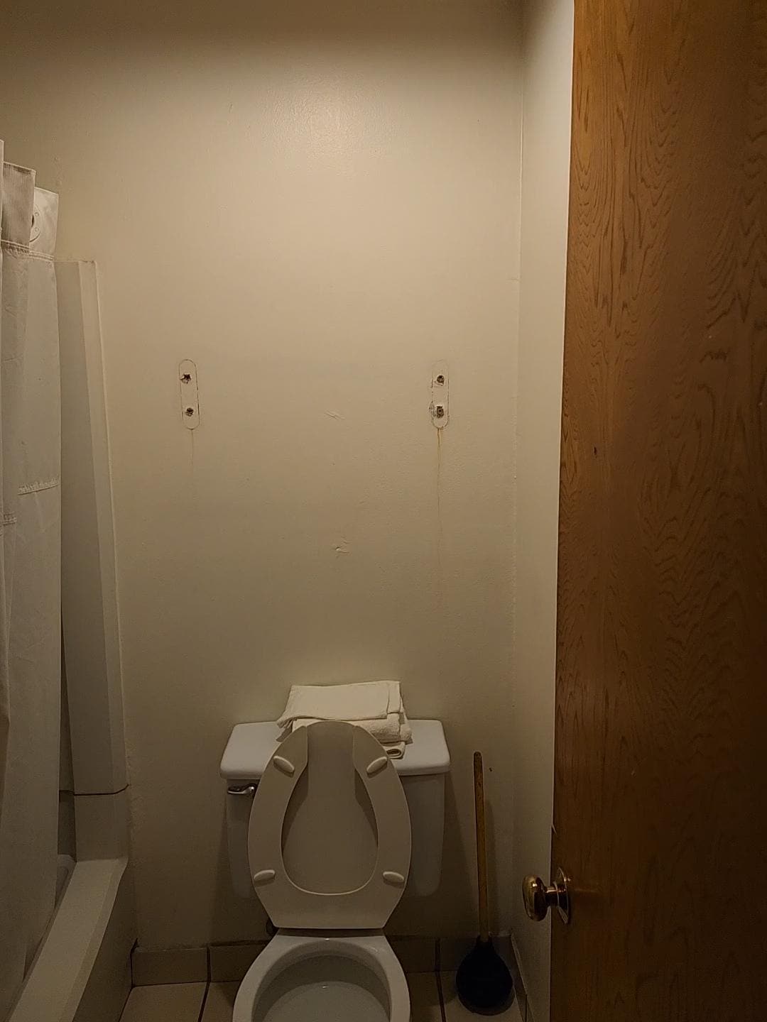 Holes in filth bathroom.