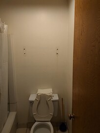 Holes in filth bathroom.