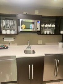 Kitchen with microwave and dishwasher and fridge with a huge freezer
