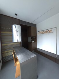 Workspace allowed for hang-dry laundry, working desk, easy tea, ironing, and an easy-to-use lock safe.