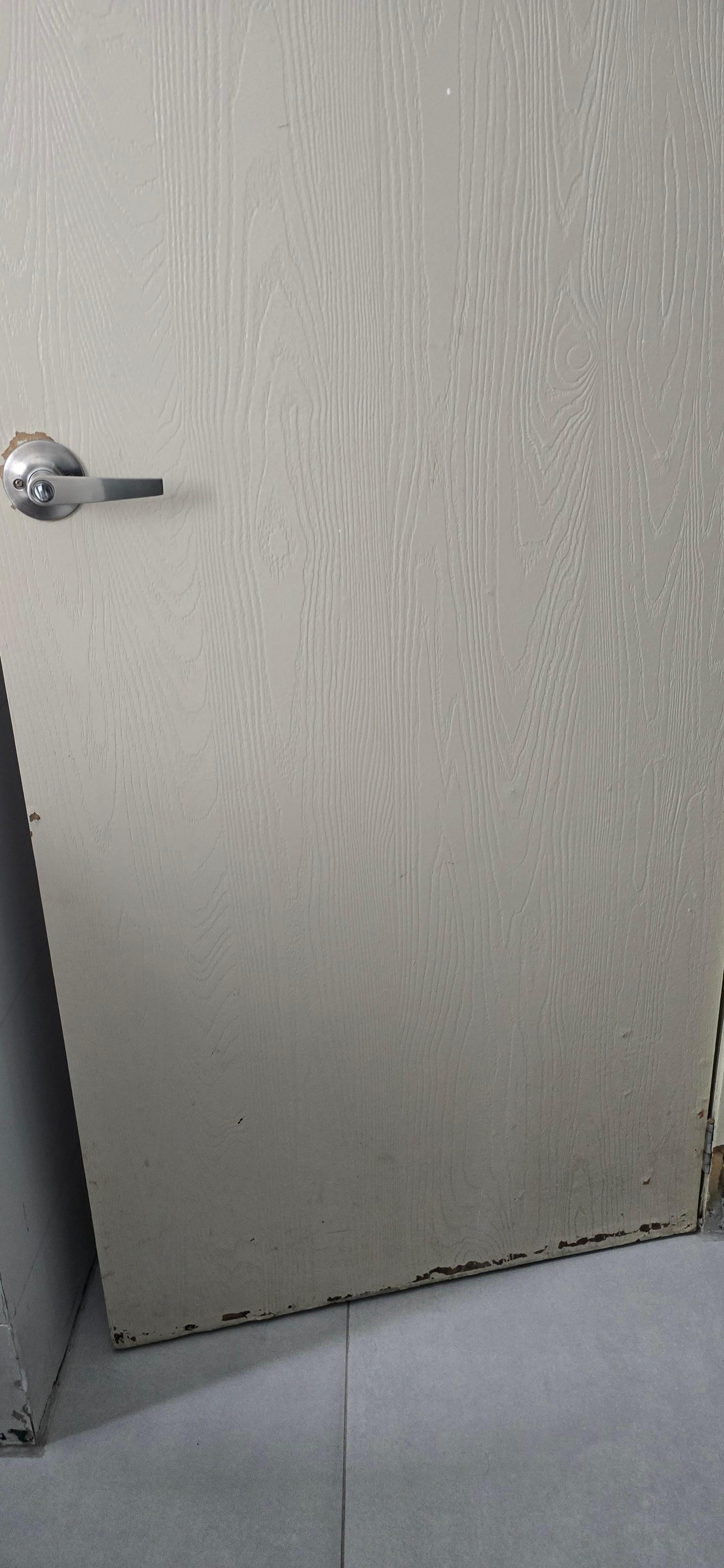Peeling door of the bathroom 