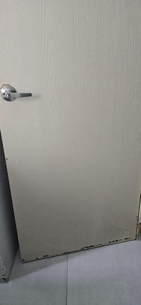 Peeling door of the bathroom