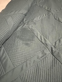 Stain on the comforter in a different bedroom.