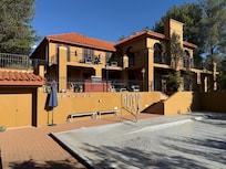 Rear of home with pool covered.