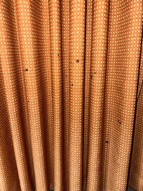 Only set of curtains for the window & it looks like cigarette burns