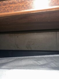 That’s how dirty the floors were all over & part of a broken crack pipe behind the bed