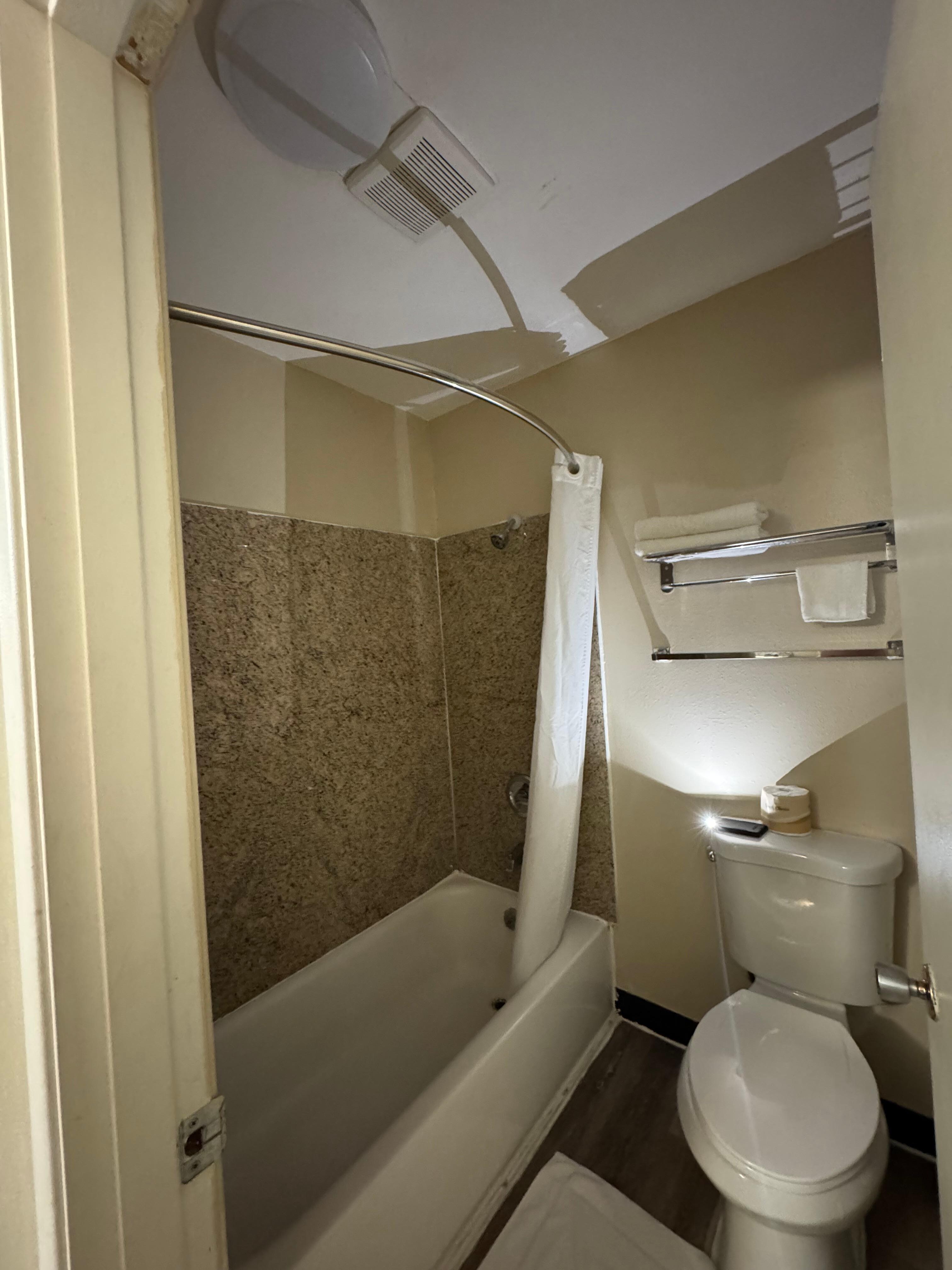 Lights and fan in bathroom stopped working. Showered with cell phone flashlight. (camera makes it seem brighter than it was)