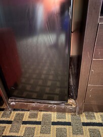 Mini refrigerator cabinet in room