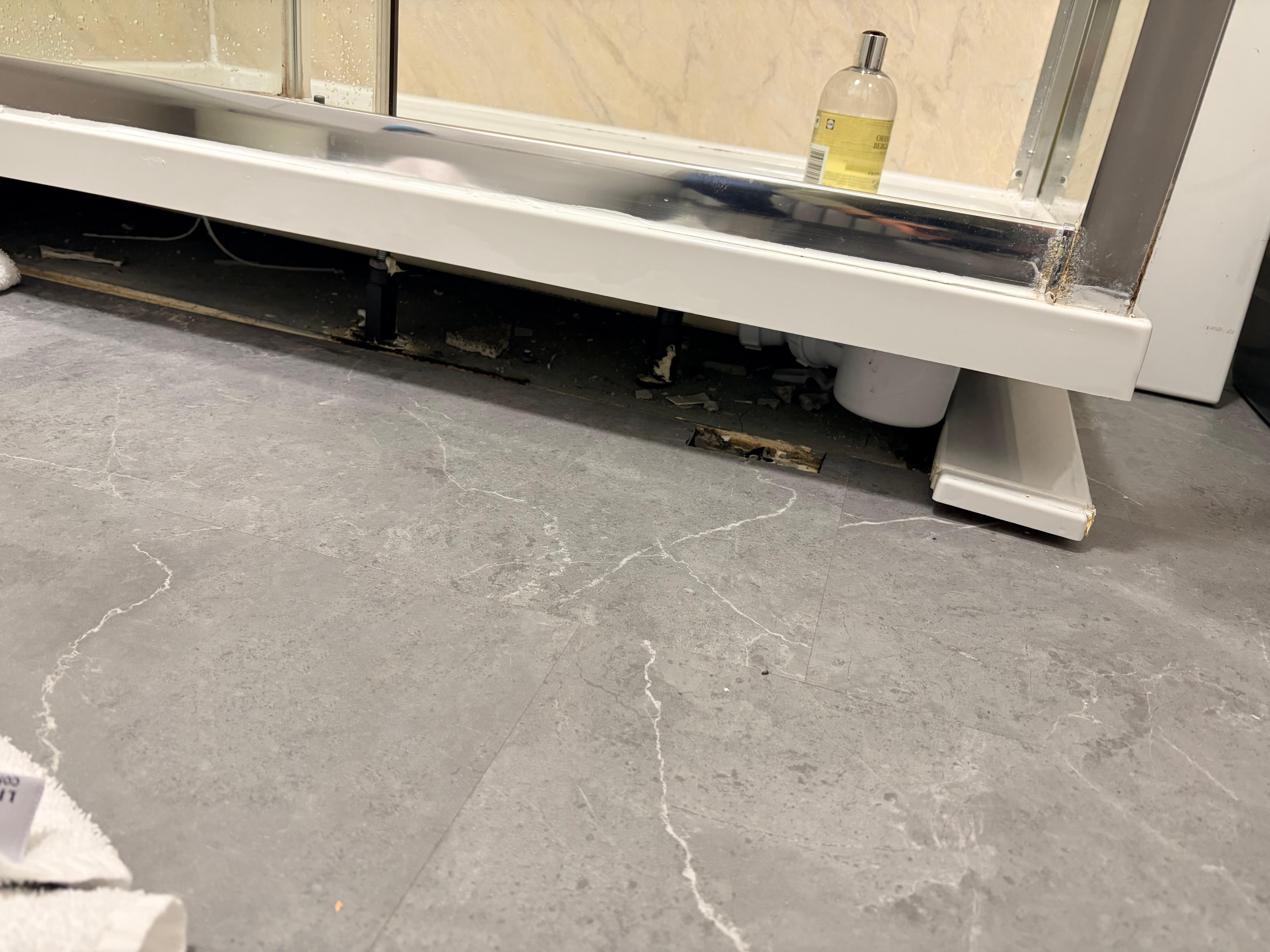 Under shower was mold and dirty. a covering was placed in front of the shower hiding dirt & mold. 