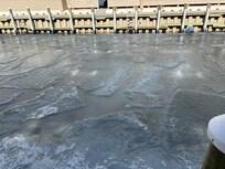 Frozen canal to the right side of building