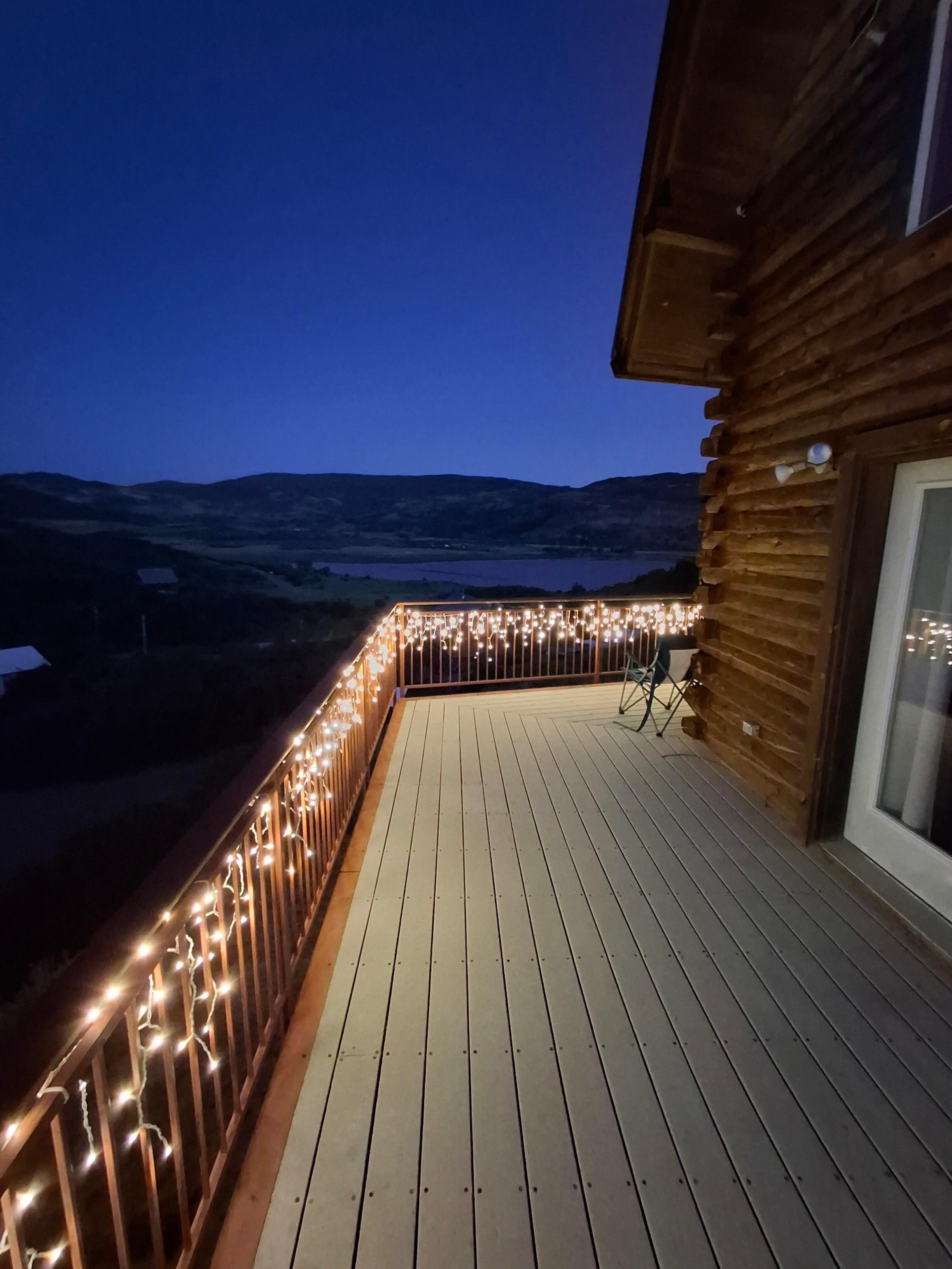 Deck at night with lights on