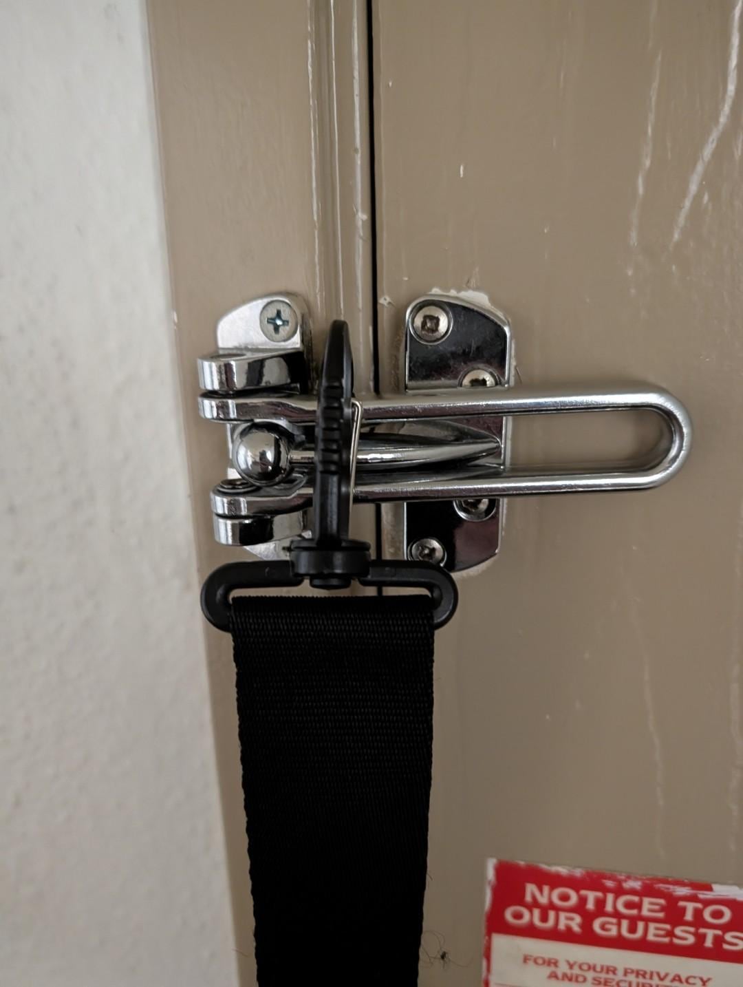 Just a note these are the type of swing locks you can open with thread or an under-door attack - I clipped a belt on it