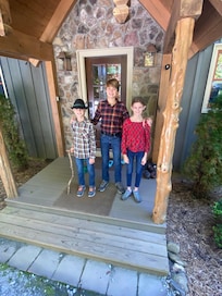 Kids on front porch ready for adventure