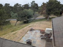 View from upstairs of the patio and surrounding yard
